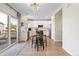 Open kitchen area next to a dining table and sliding glass door leading to the backyard at 4947 Stoneham Ave, Castle Rock, CO 80104