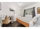 Bright bedroom with natural light, closet, and hardwood floors at 739 S Utica St, Denver, CO 80219