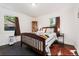 Comfortable bedroom with natural light, hardwood floors, and stylish furnishings at 739 S Utica St, Denver, CO 80219