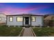 Charming single-story home boasts an updated front exterior with meticulous landscaping and welcoming curb appeal at 739 S Utica St, Denver, CO 80219