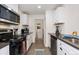 Well-appointed kitchen with stainless steel appliances and plenty of counter space, ideal for culinary exploration at 739 S Utica St, Denver, CO 80219