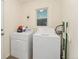 Functional laundry room with a washer and dryer, and natural light at 739 S Utica St, Denver, CO 80219