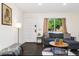 Comfortable living room showcasing natural light and cozy decor, perfect for relaxation and entertaining at 739 S Utica St, Denver, CO 80219