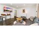 Open-concept living room featuring hardwood floors, recessed lighting, and stylish furnishings, creating an inviting atmosphere at 739 S Utica St, Denver, CO 80219