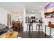 Open floor plan features a spacious kitchen, dining area and living area for a seamless, versatile living space at 739 S Utica St, Denver, CO 80219