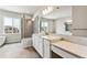 Modern bathroom featuring a large soaking tub, shower and double vanity at 2596 Bailey Ln, Erie, CO 80026