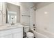 Cozy bathroom featuring a vanity and shower/tub combo at 2596 Bailey Ln, Erie, CO 80026