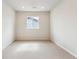 Bright bedroom featuring neutral carpet, a window, recessed lighting, and freshly painted walls at 2596 Bailey Ln, Erie, CO 80026