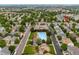 Aerial view of community park and pool including address of property at 1179 S Alton Ct, Denver, CO 80247