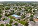 Aerial view of a neighborhood featuring a pool, clubhouse, playground, and green spaces at 1179 S Alton Ct, Denver, CO 80247