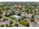 This aerial view showcases the community pool, playground, and surrounding neighborhood of 1179 S Alton at 1179 S Alton Ct, Denver, CO 80247