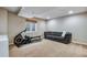 Finished basement with carpet, recessed lights, window, and sofa for a comfortable space at 1179 S Alton Ct, Denver, CO 80247