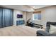 Finished basement with exercise equipment, storage, and a cozy sofa for relaxing at 1179 S Alton Ct, Denver, CO 80247