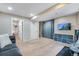 Spacious finished basement with television, storage and comfortable seating area at 1179 S Alton Ct, Denver, CO 80247
