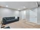 Finished basement with comfortable seating, recessed lighting, and access to other rooms at 1179 S Alton Ct, Denver, CO 80247