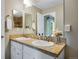 Bathroom features double sinks, vanity with countertop, and a large mirror at 1179 S Alton Ct, Denver, CO 80247