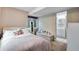 Bright bedroom with many stuffed animals and a large window for natural light at 1179 S Alton Ct, Denver, CO 80247