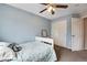 Bright bedroom features a ceiling fan and a large closet for plenty of storage space at 1179 S Alton Ct, Denver, CO 80247
