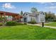 Charming community clubhouse with pergola and lush green lawn, perfect for gatherings at 1179 S Alton Ct, Denver, CO 80247