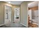 Hallway with entrances to a bedroom and bathroom in a cozy home at 1179 S Alton Ct, Denver, CO 80247