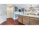 Open kitchen layout with granite island, stainless appliances, and seamless flow to living areas at 1179 S Alton Ct, Denver, CO 80247