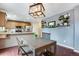 Open kitchen with modern appliances, stylish decor, and hardwood floors at 1179 S Alton Ct, Denver, CO 80247