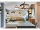 Inviting living room featuring a sectional sofa, fireplace, and modern lighting fixtures at 1179 S Alton Ct, Denver, CO 80247