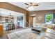 Open-concept living room flowing into the kitchen and dining area, perfect for entertaining at 1179 S Alton Ct, Denver, CO 80247