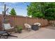 Relaxing patio with fire pit, chairs, and string lights for a cozy outdoor space at 1179 S Alton Ct, Denver, CO 80247