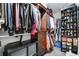 Organized walk-in closet with shelving, hanging rods, and ample storage space at 1179 S Alton Ct, Denver, CO 80247