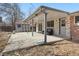 Covered backyard patio with outdoor seating, adjacent to a well-maintained yard at 2572 Beech Ct, Golden, CO 80401