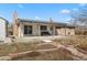 Brick home backyard with a covered patio, ideal for relaxing or entertaining guests at 2572 Beech Ct, Golden, CO 80401
