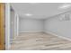 Spacious basement featuring durable plank flooring and neutral paint, perfect for flexible living at 2572 Beech Ct, Golden, CO 80401