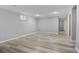 Basement with plank flooring, neutral paint, and natural light from a small window at 2572 Beech Ct, Golden, CO 80401