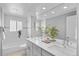 Bright bathroom featuring double sinks, modern fixtures, and stylish decor at 2572 Beech Ct, Golden, CO 80401