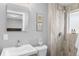 Bright bathroom features walk-in shower with tiled walls and updated vanity at 2572 Beech Ct, Golden, CO 80401