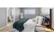 Bedroom featuring a window and full sized bed with black metal side table and hanging pendant lamp at 2572 Beech Ct, Golden, CO 80401