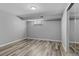 This bedroom features contemporary flooring, a window for natural light, and closet with mirror at 2572 Beech Ct, Golden, CO 80401