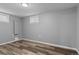 Bedroom with plank floors and two windows providing natural light at 2572 Beech Ct, Golden, CO 80401