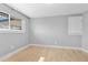 Bright bedroom with light hardwood floors and natural light from a large window at 2572 Beech Ct, Golden, CO 80401