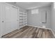 Well-lit bedroom with closet and storage offers both style and practicality at 2572 Beech Ct, Golden, CO 80401