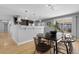 Bright dining area featuring stylish table, seating, and sliding door access to an outdoor space at 2572 Beech Ct, Golden, CO 80401