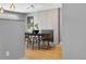 View of the dining room featuring hardwood floors and a modern fireplace with tile surround at 2572 Beech Ct, Golden, CO 80401
