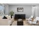 Bright living room featuring hardwood floors, stylish furniture, and an open layout at 2572 Beech Ct, Golden, CO 80401