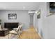 Bright living room featuring hardwood floors, stylish furniture, and an open layout at 2572 Beech Ct, Golden, CO 80401