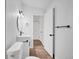 Stylishly updated bathroom featuring black hardware and wood-look floor at 225 E 8Th Ave # A2, Longmont, CO 80504