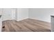 Bedroom featuring neutral paint, new vinyl floors, and lots of natural light at 225 E 8Th Ave # A2, Longmont, CO 80504