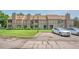 Exterior shot of townhomes with grass and parking at 225 E 8Th Ave # A2, Longmont, CO 80504