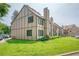 Exterior view of building with well-maintained lawn at 225 E 8Th Ave # A2, Longmont, CO 80504