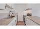 Modern kitchen featuring stainless steel appliances, granite countertops, and white cabinetry at 225 E 8Th Ave # A2, Longmont, CO 80504